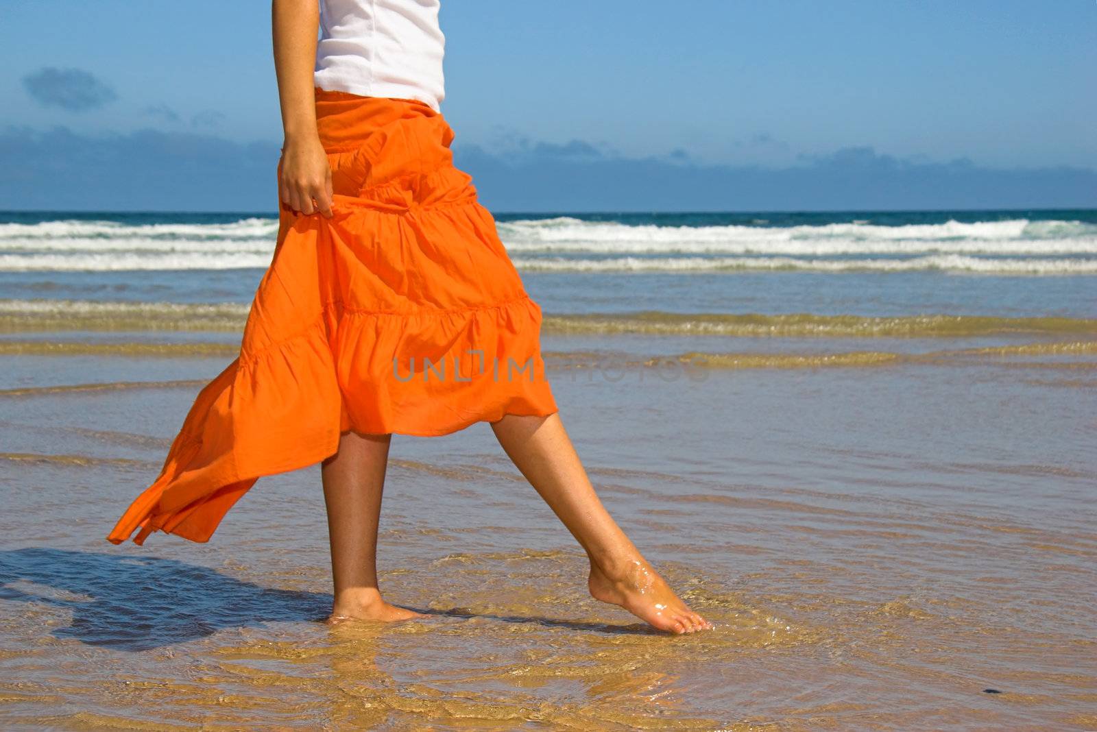 Woman feeling the water with the foot