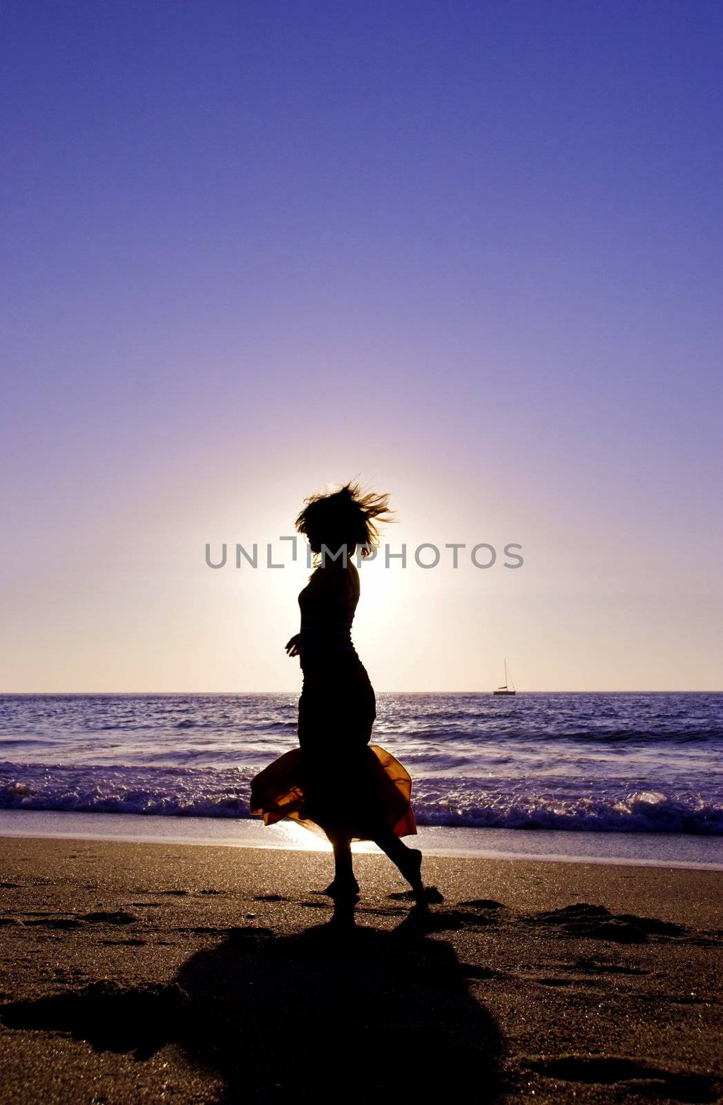 Woman silhouette at the sunset