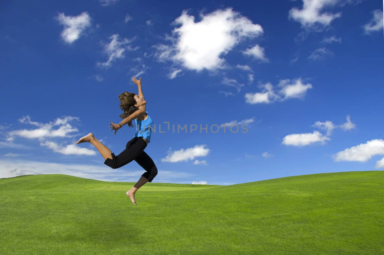 Athletic woman jumping by Iko