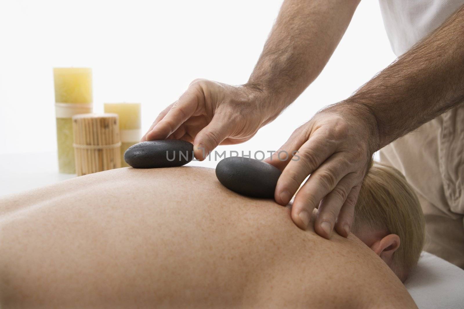 Hot stone massage. by iofoto