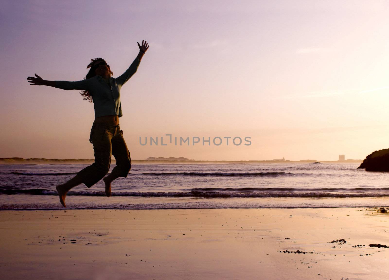 Woman doing exercise on the beach