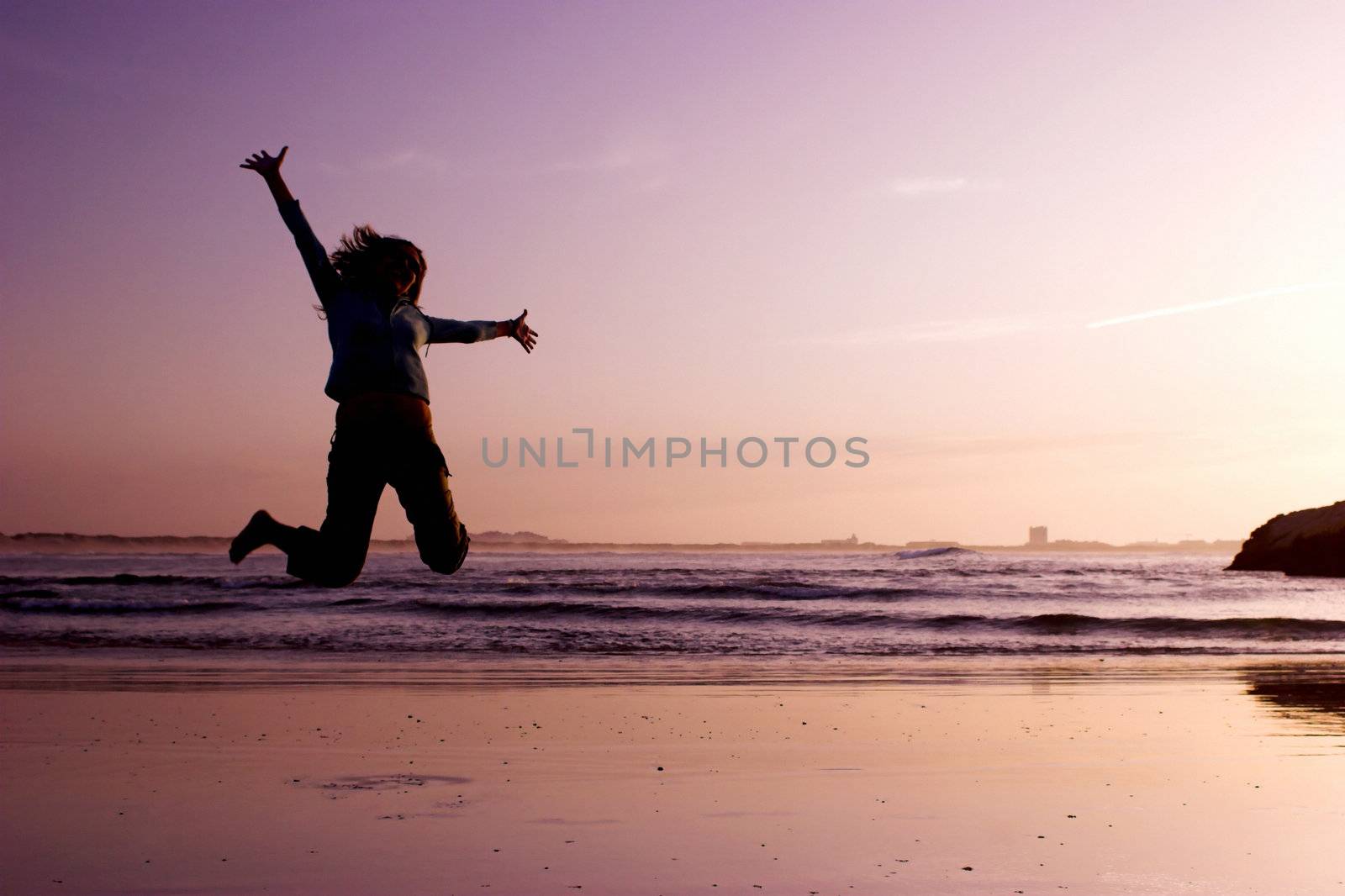 Woman doing exercise on the beach