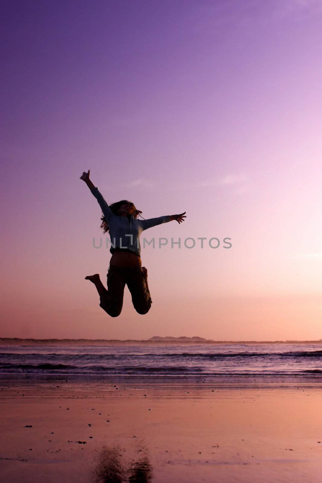 Woman doing exercise on the beach