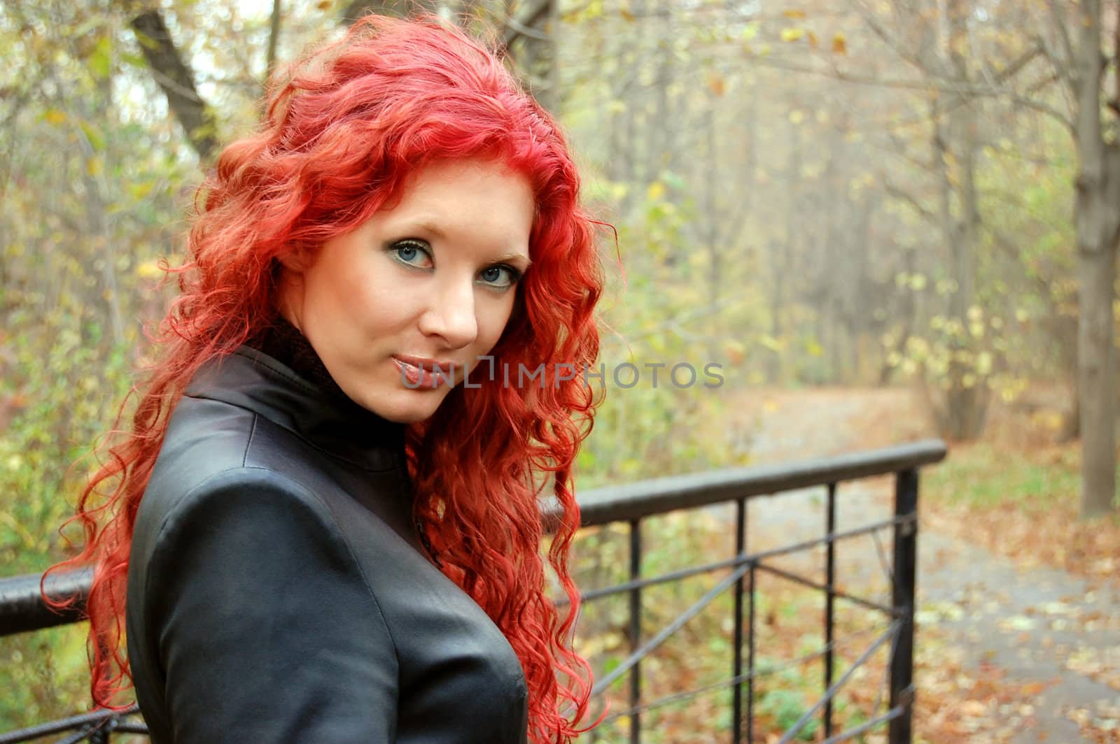 red hair gothic style woman over autumn background