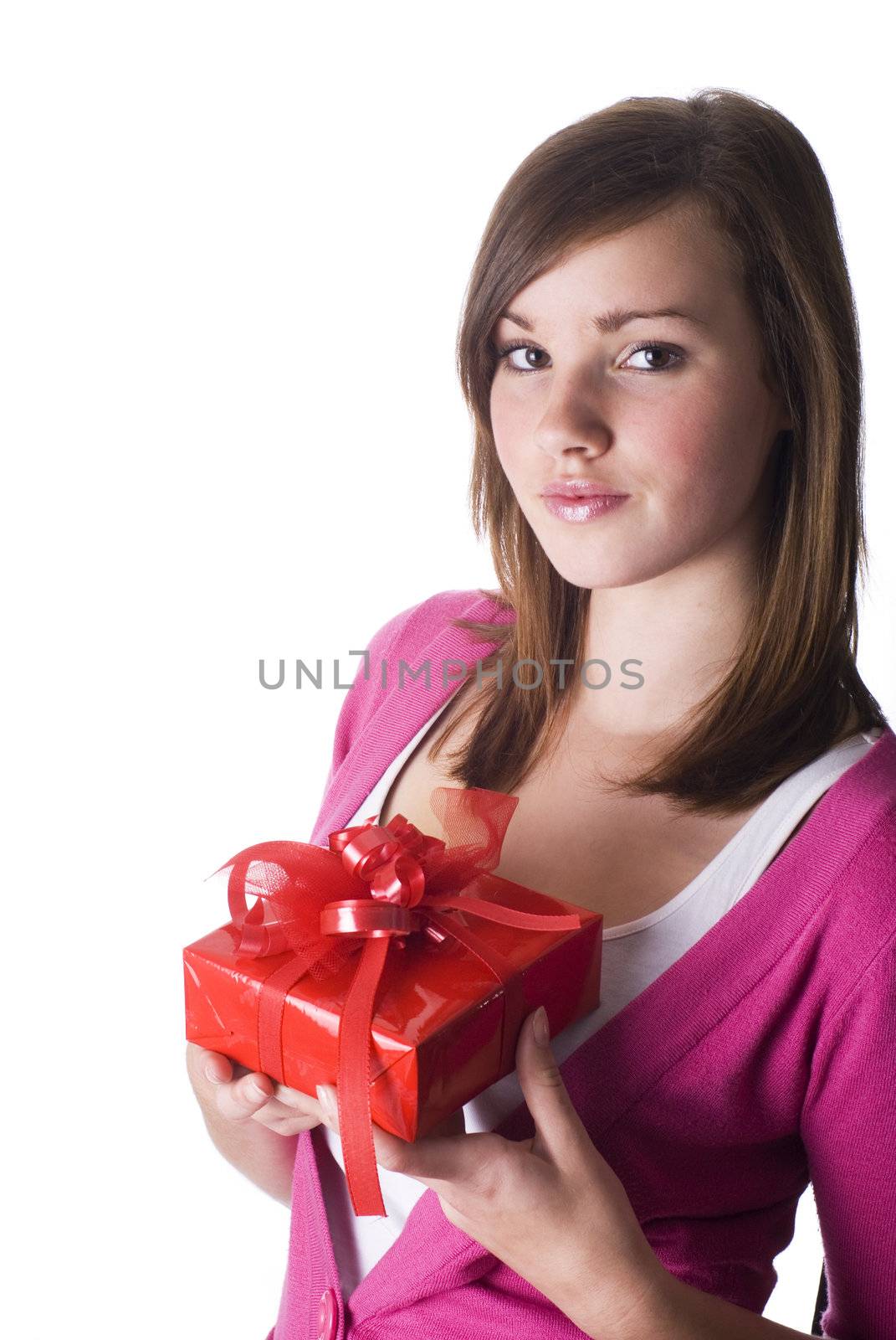 Pretty girl holding a nice wrapped gift; isolated on white.       