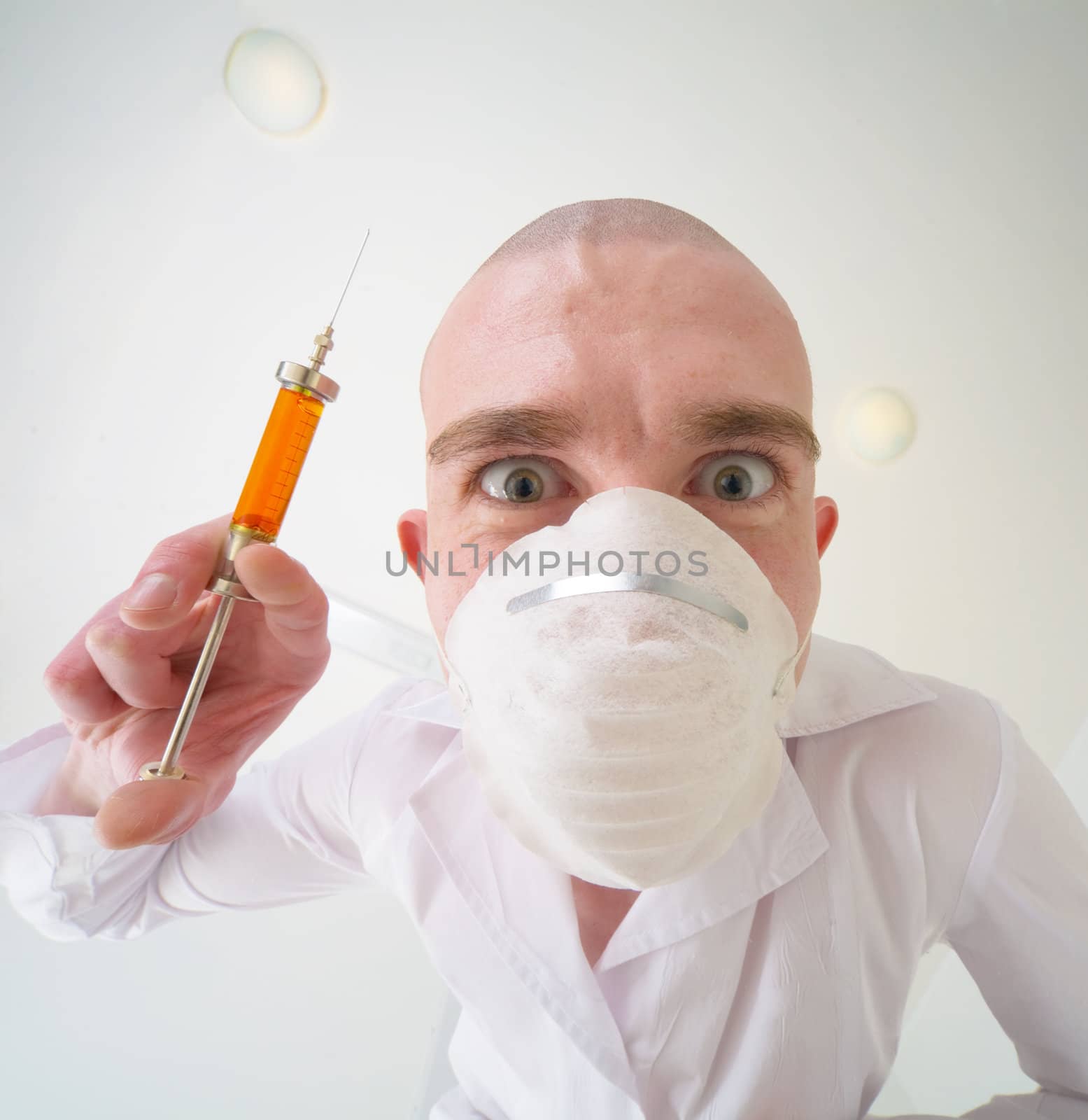 Ominous doctor with syringe in the hand