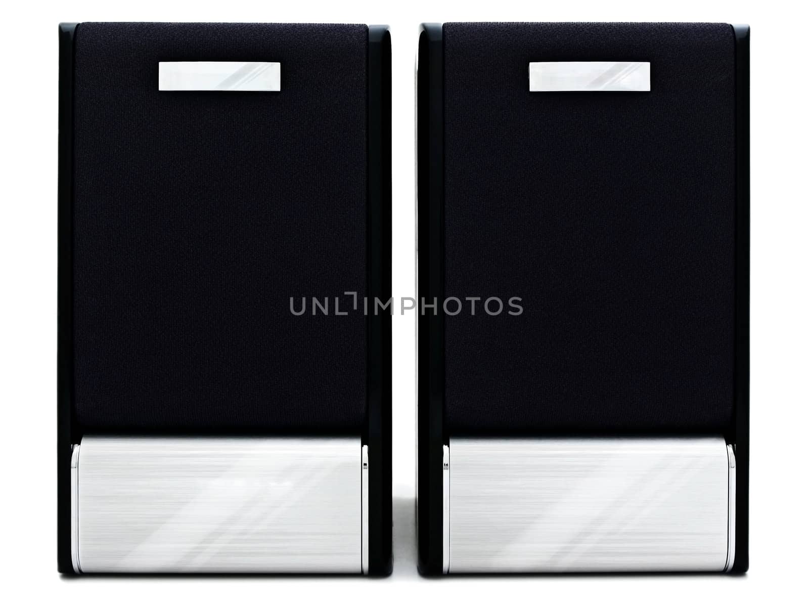 two modern loudspeakers against the white background