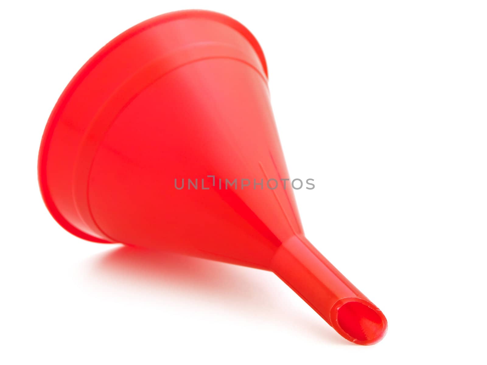 red plastic kitchen funnel against white background 