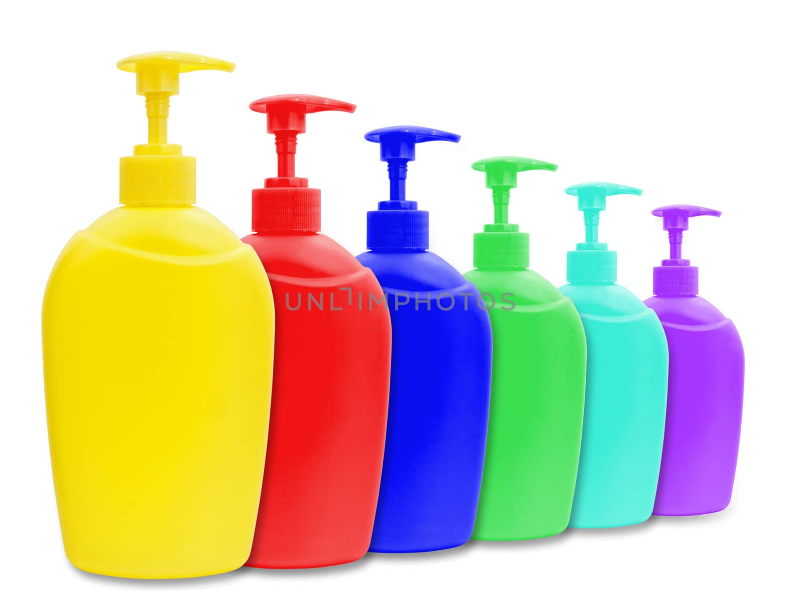 different multicolored plastic bottle of liquid soap over white