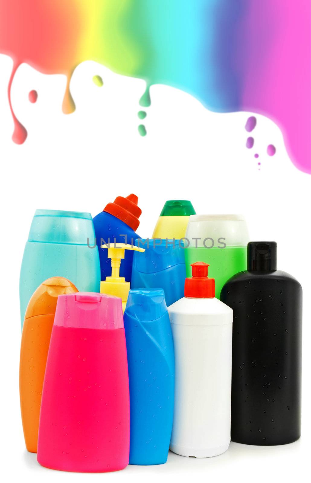 different toiletries plastic bottles over the white