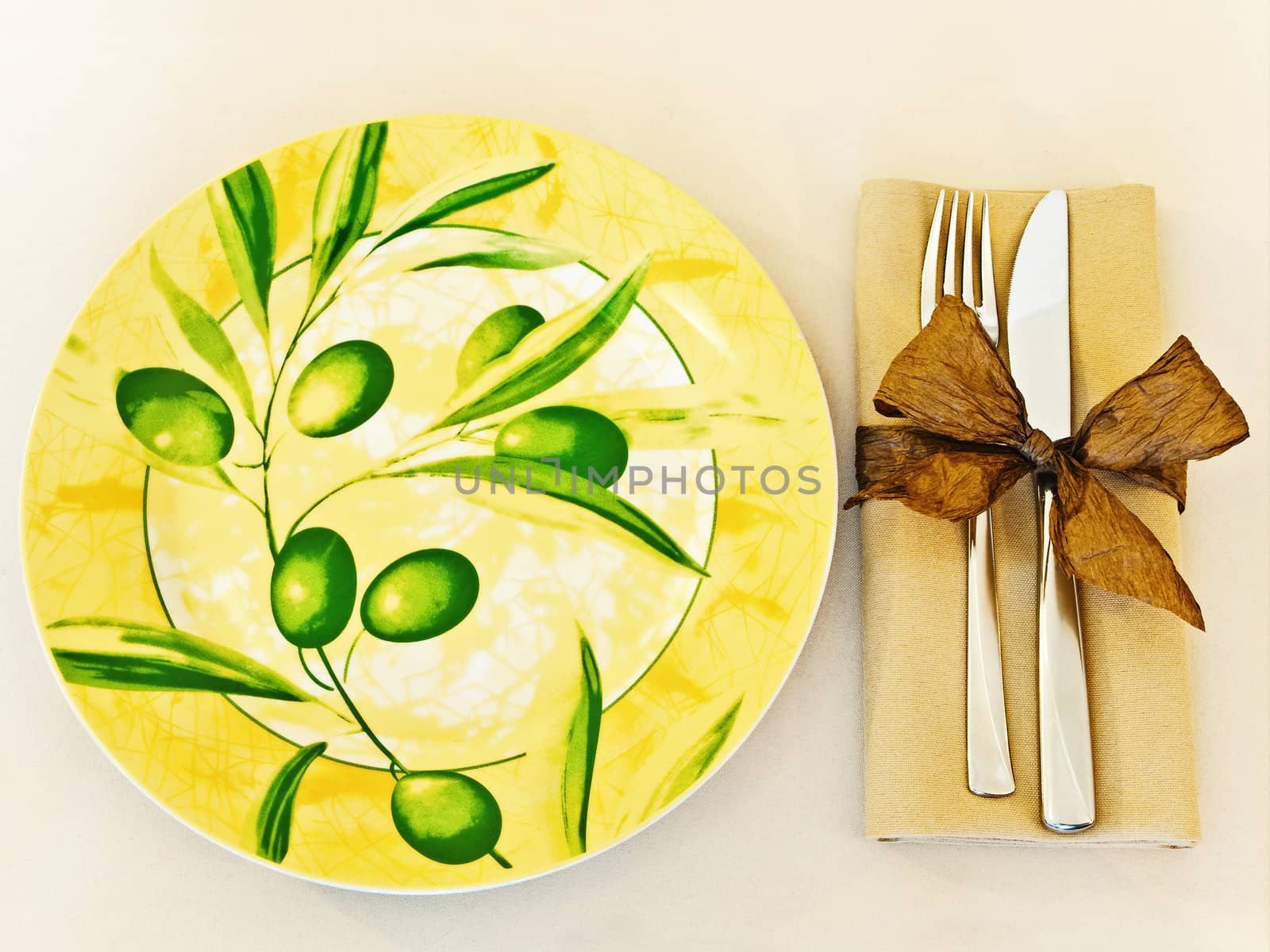 decorated table serving with serviette and knife,fork at beige 