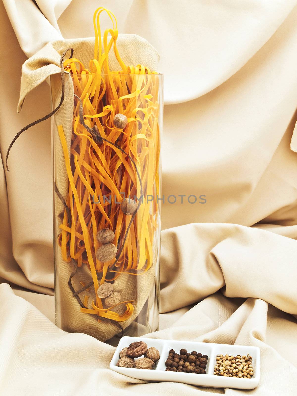 decorated spices against beige textile drapery