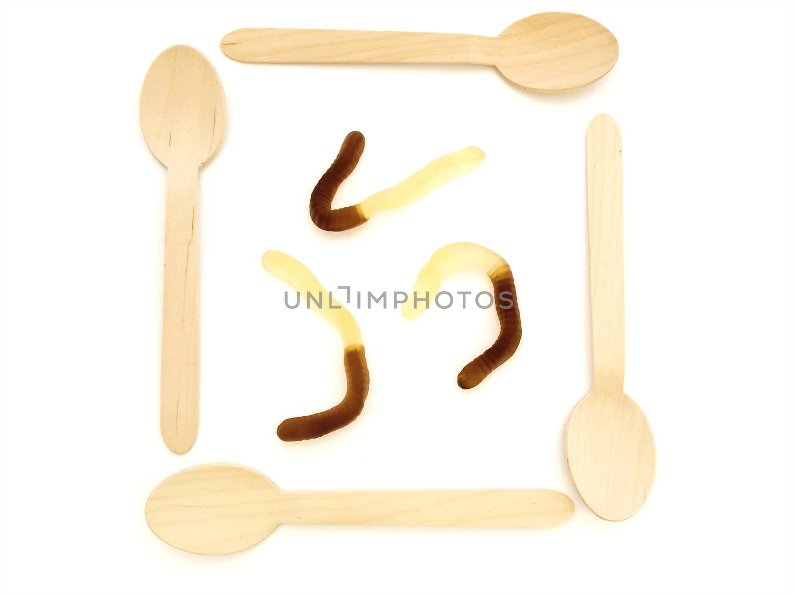 wooden spoons with amazing colorful tasty jelly candies against white background