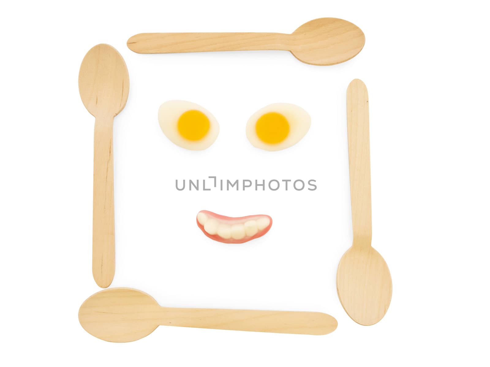 wooden spoons with amazing colorful tasty jelly candies in face shape