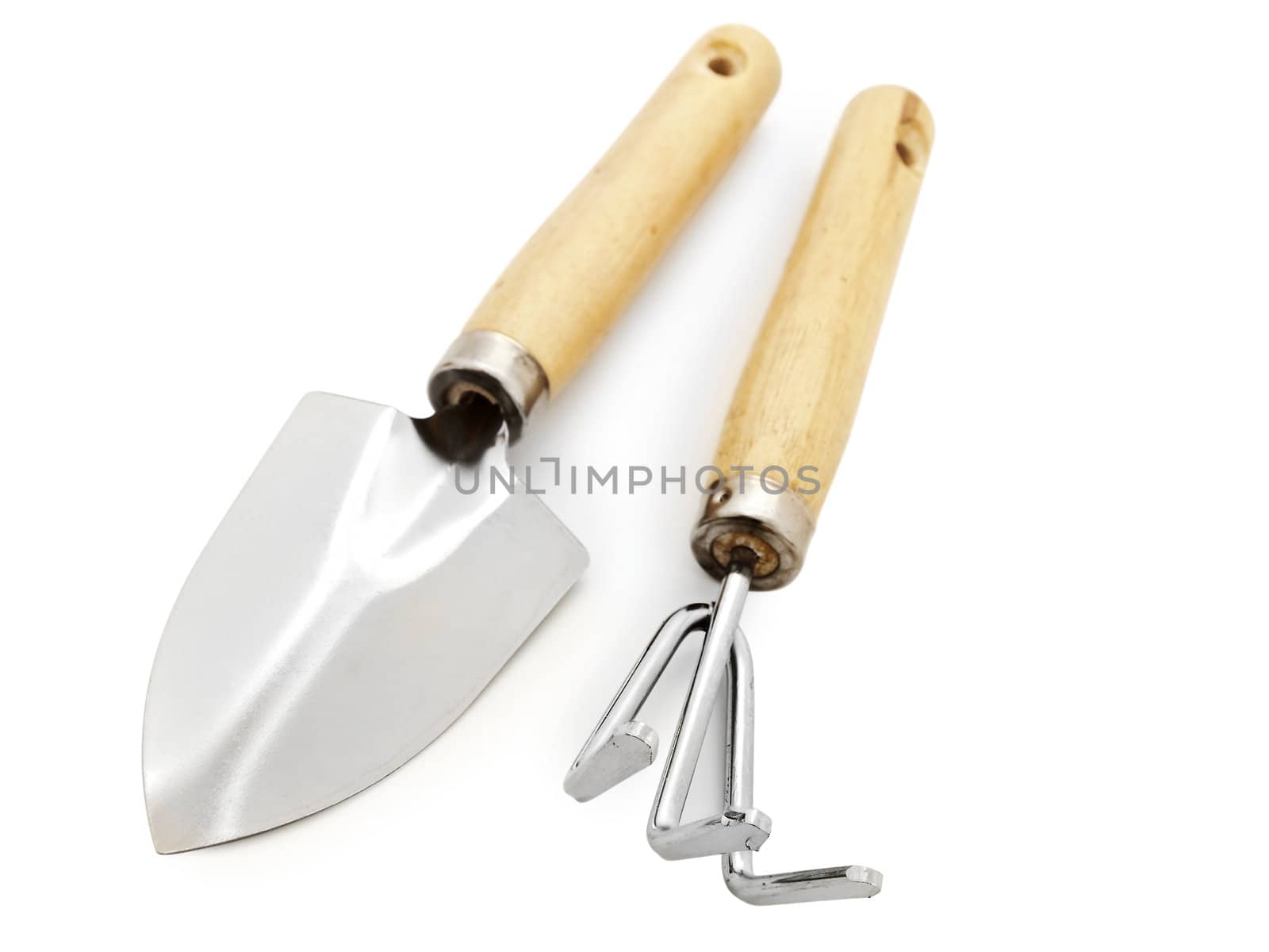Different gardening tools against white background