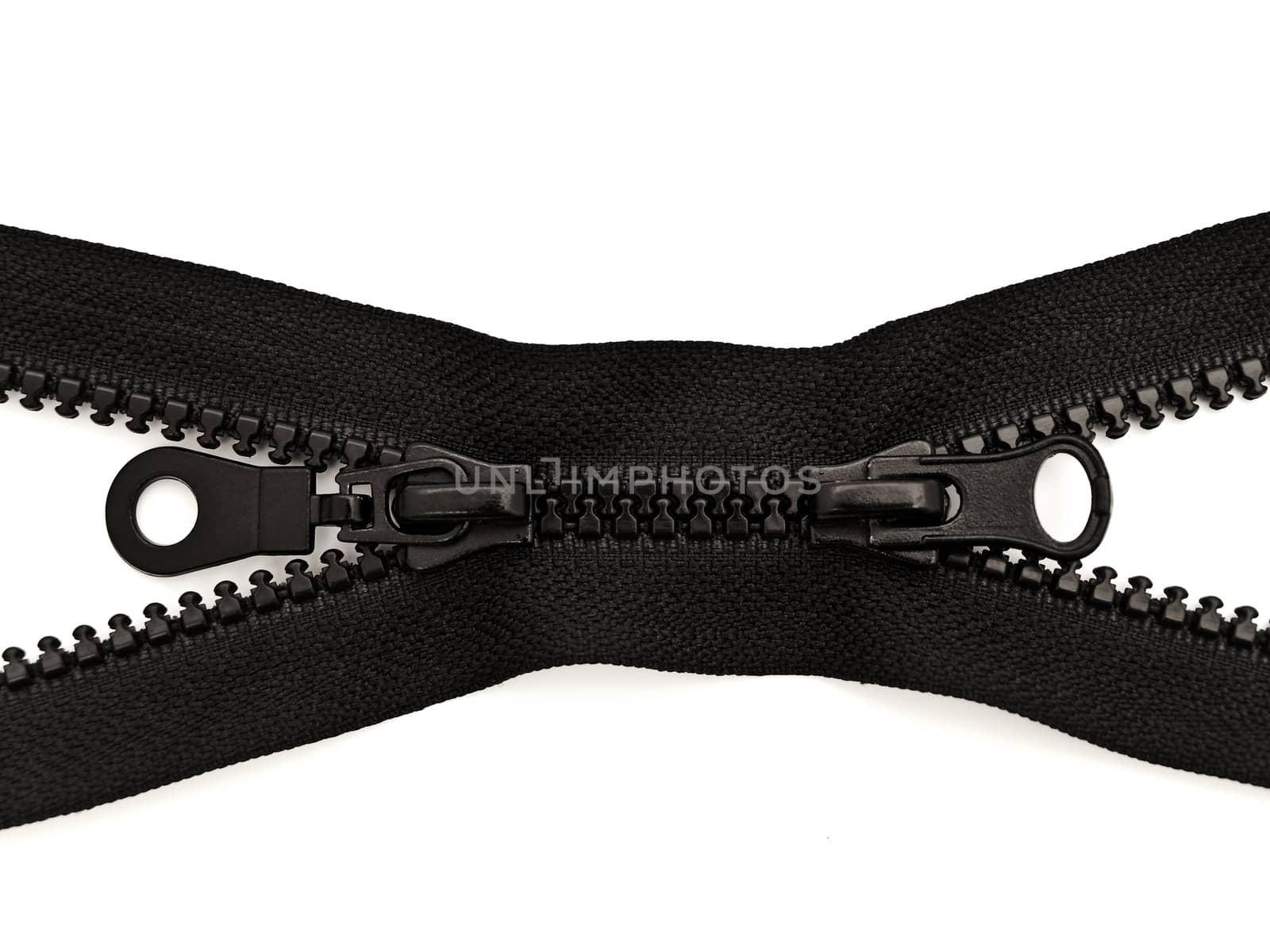 black plastic opened double zipper against white background