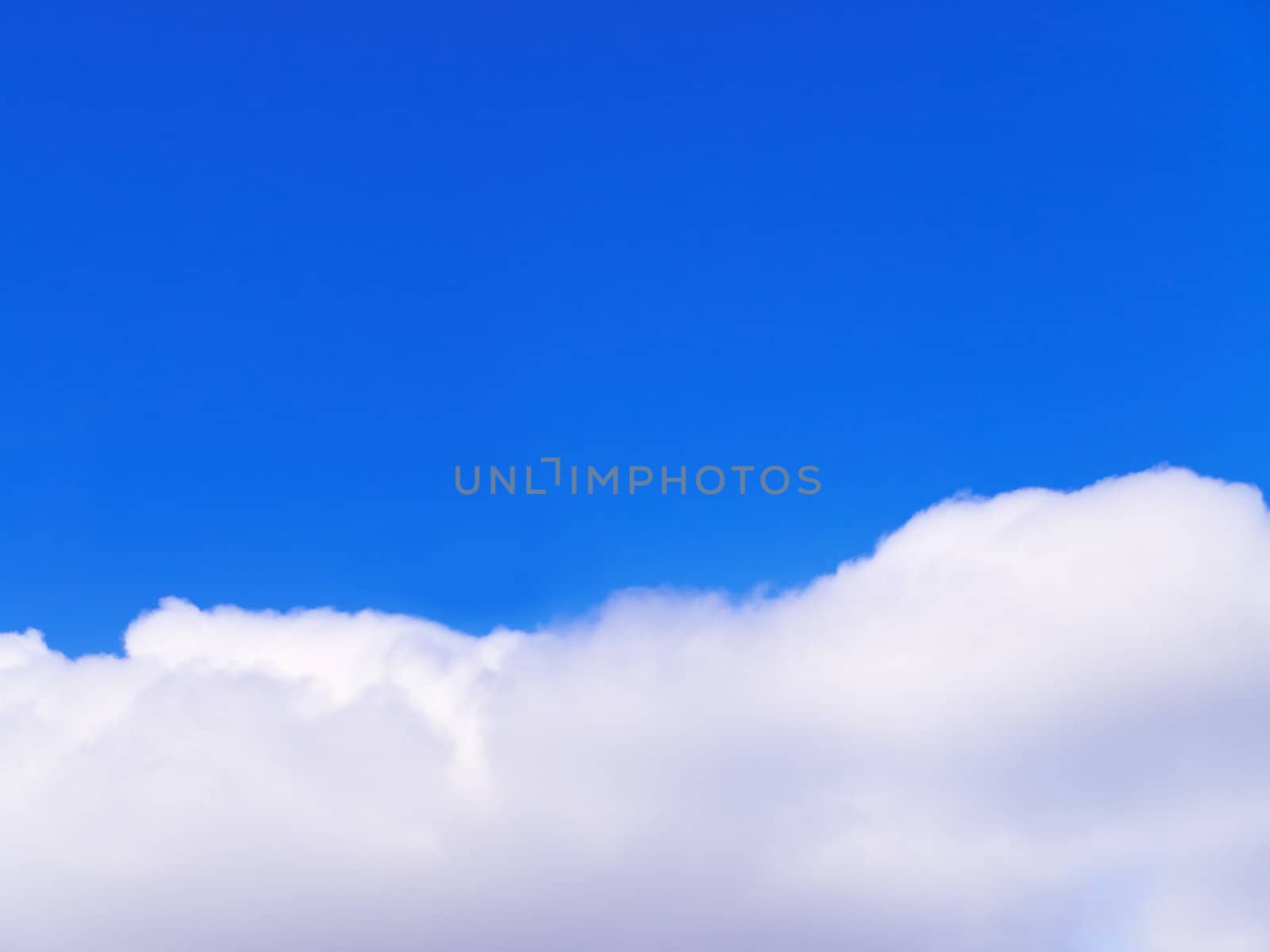 clear blue sky over the single cloud