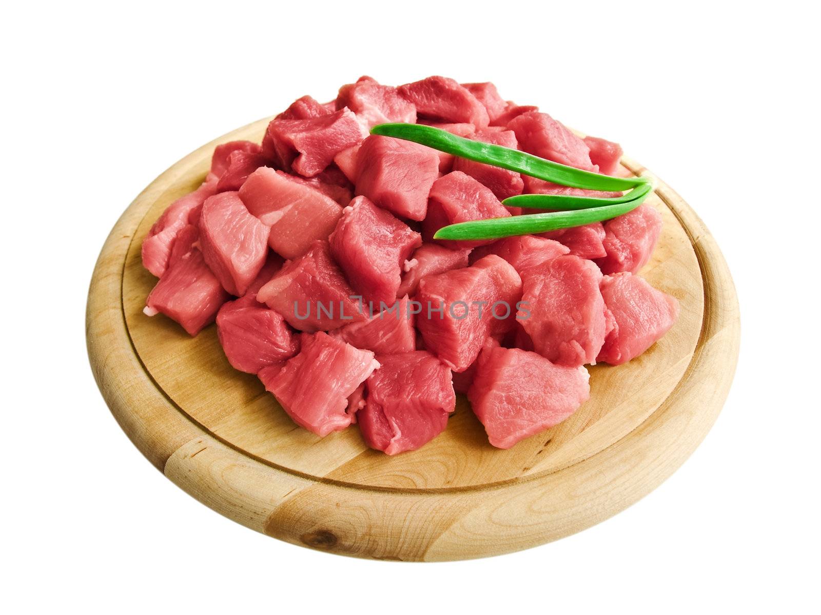 meat with greens on hardboard over the white background