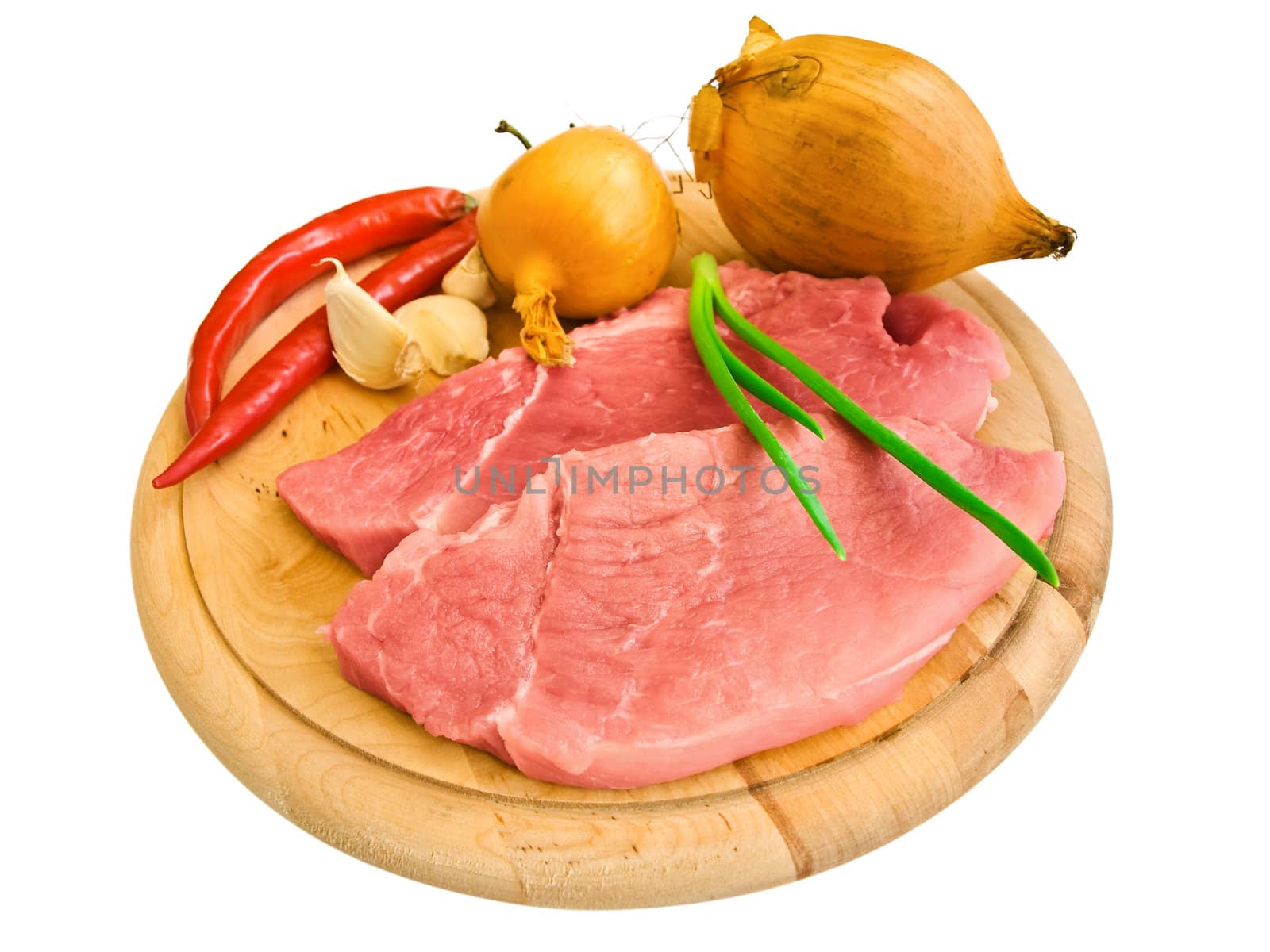 piecies of meat with different vegetables on the hardboard