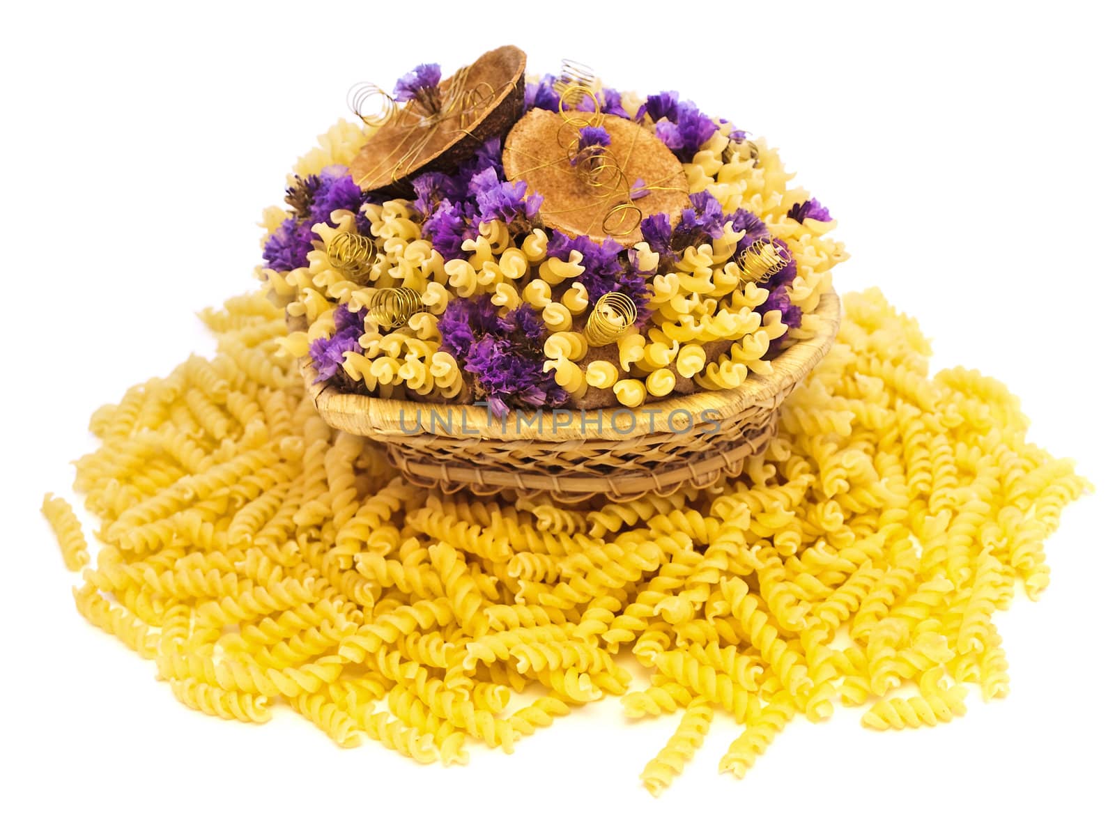 yellow pasta and flowers in the basket