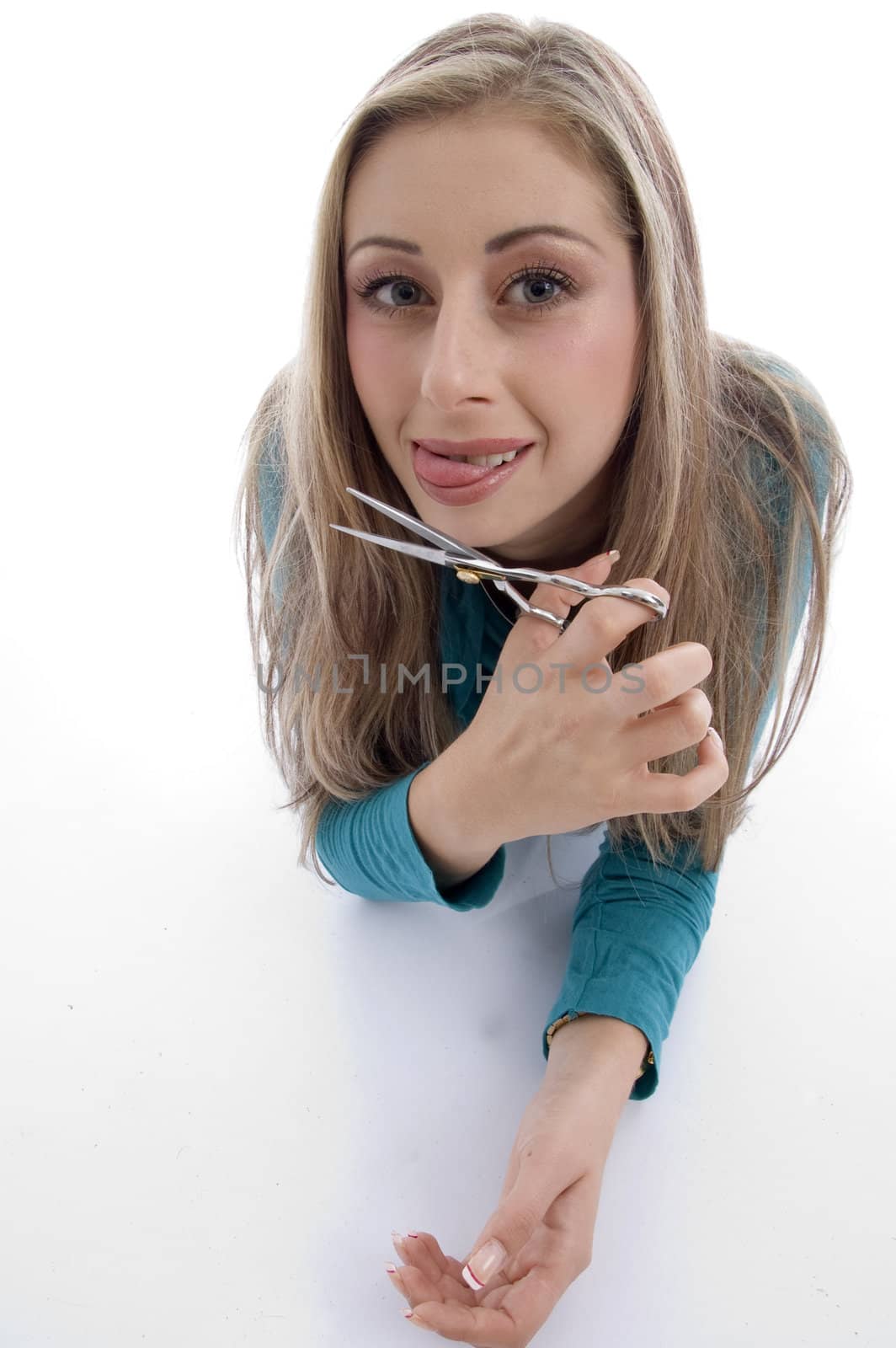 laying woman holding scissor with white background