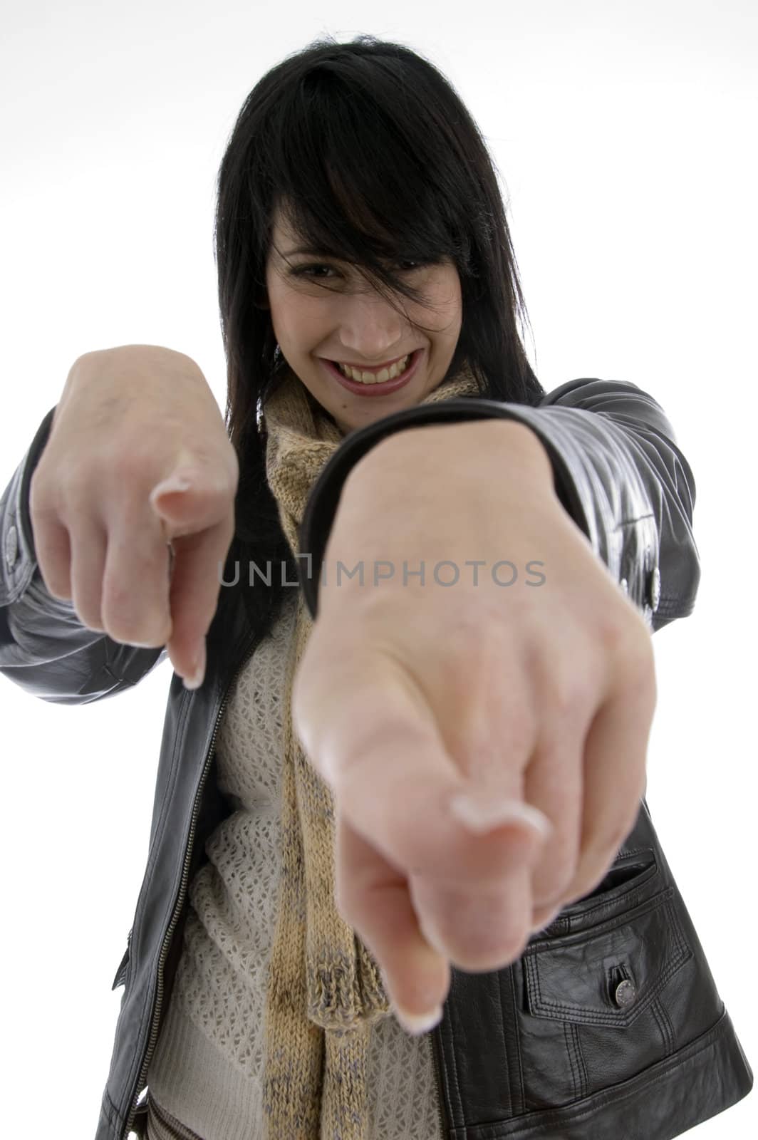 cheerful woman pointing towards camera on an isolated white background