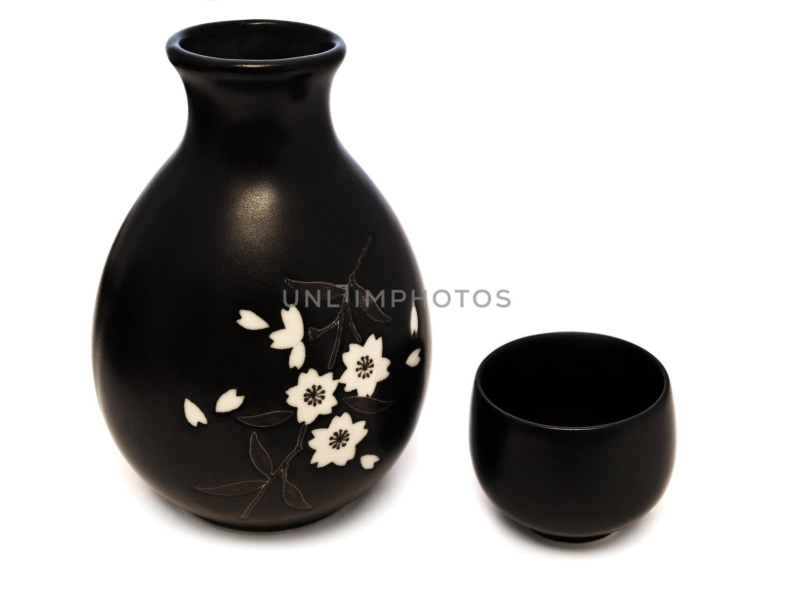 Traditional oriental style Sake set from a jug ahdbowl cup.