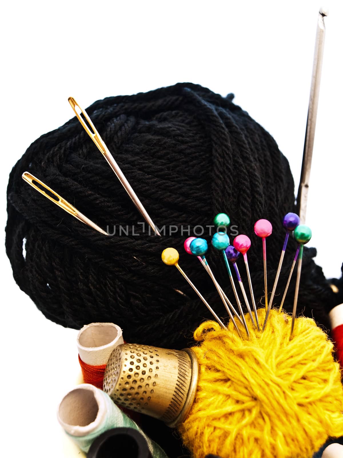 different knitting items over the white background