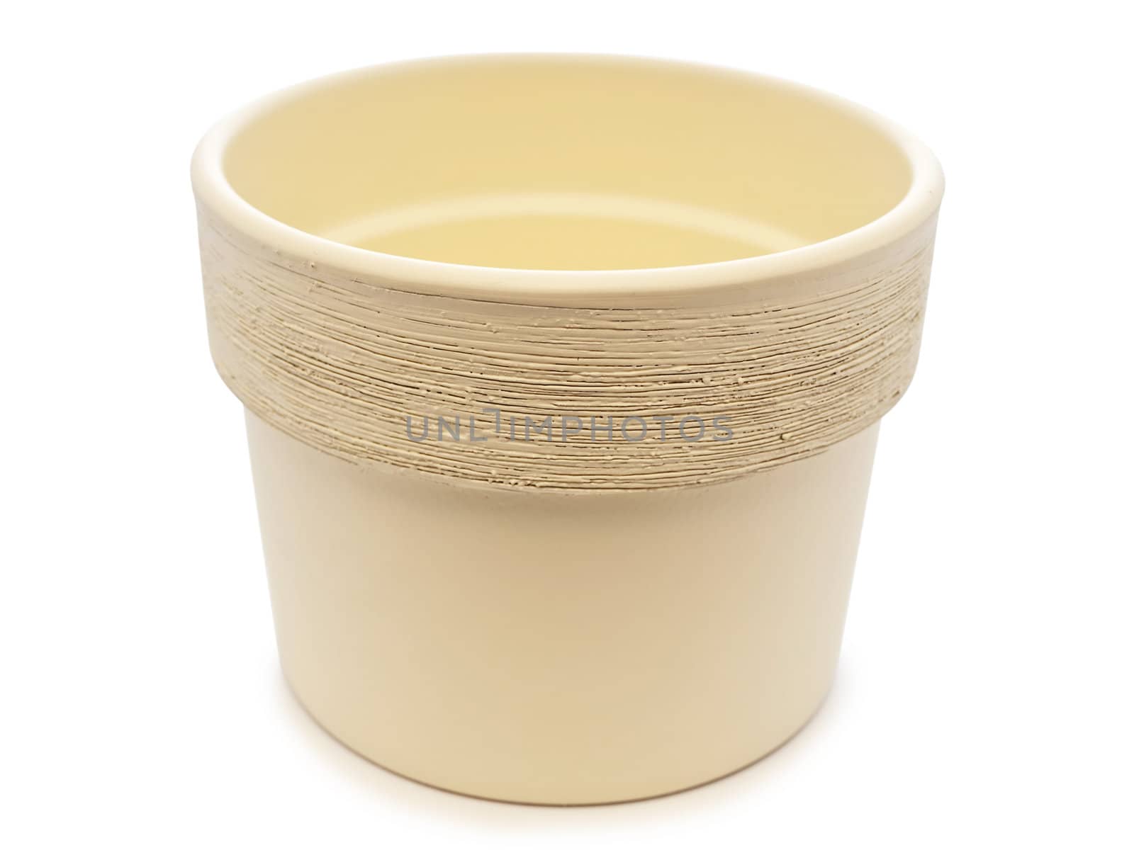empty beige flowerpot over the black background