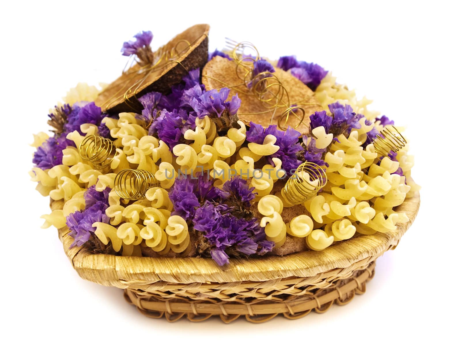  yellow pasta and flowers in the basket 