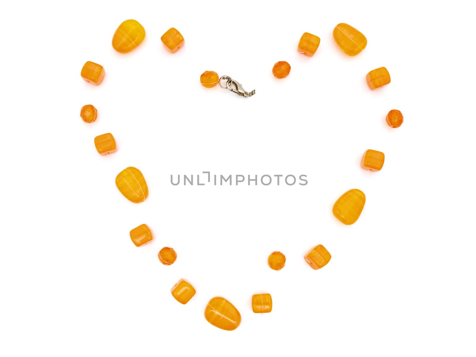 fashion amber necklace in heart shape over white background