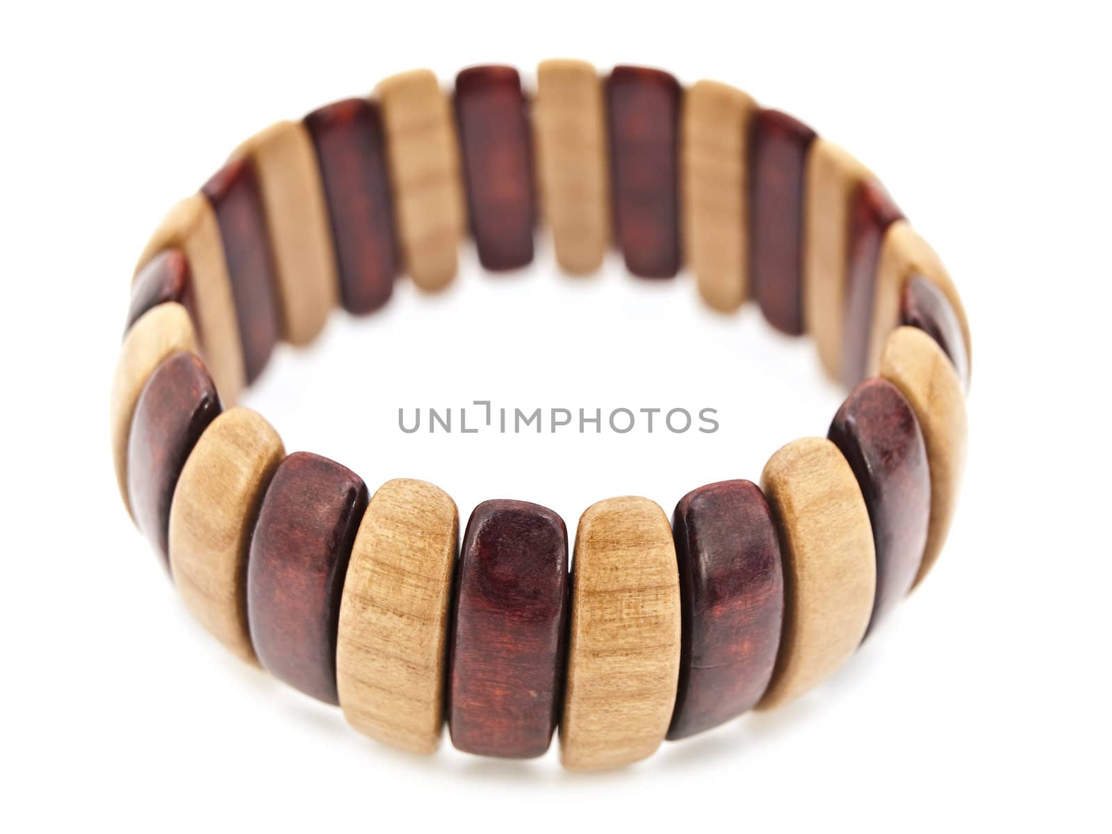 wooden bracelet over white background