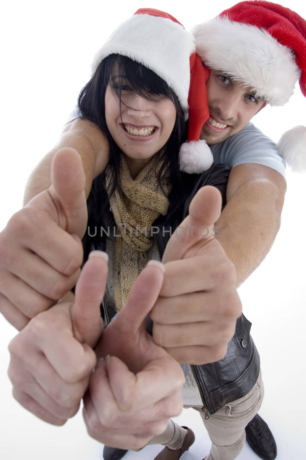 young couple with chritsmas hat on an isolated white backgound