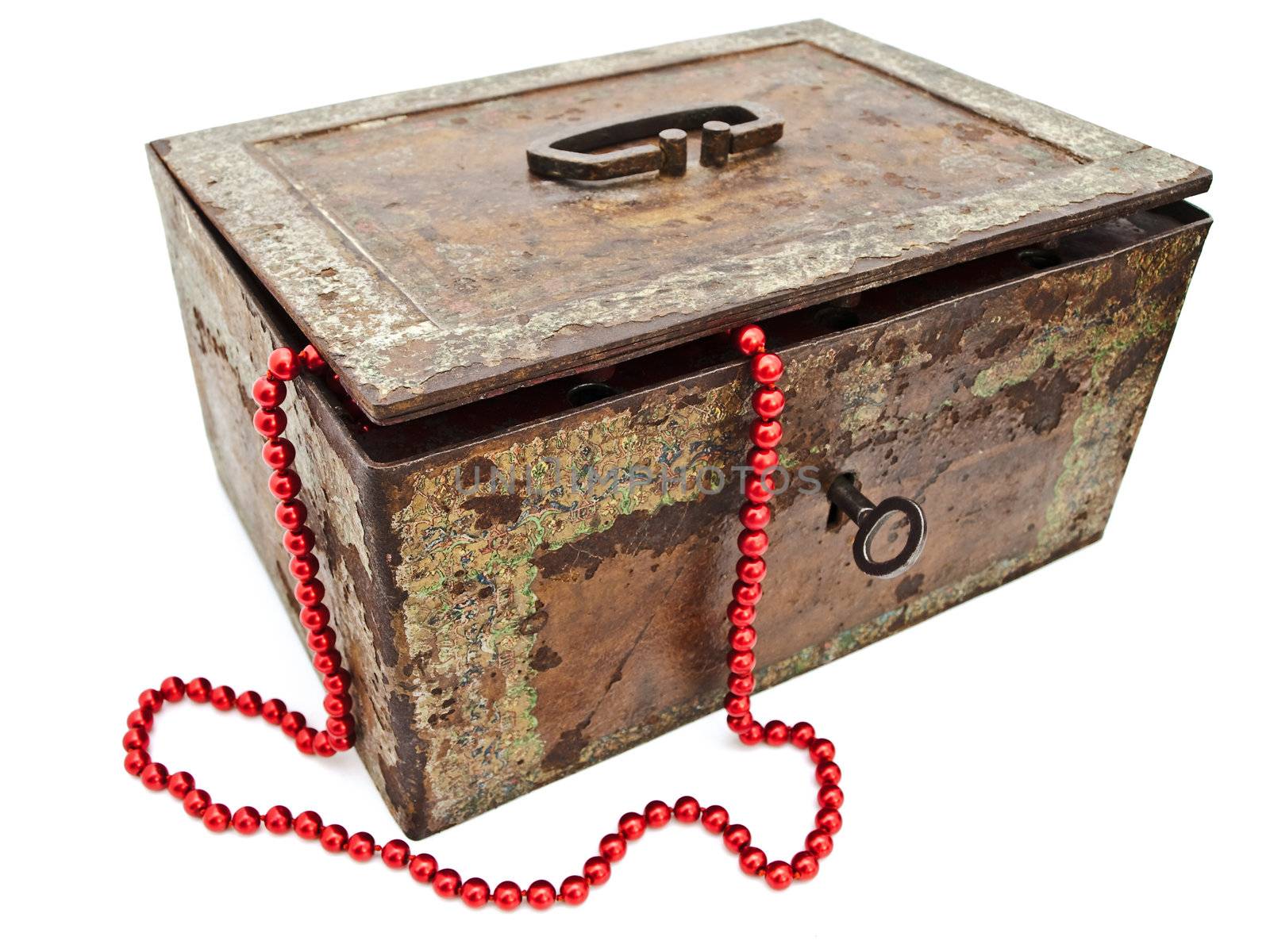 red chaplet in old rusty chest over white background