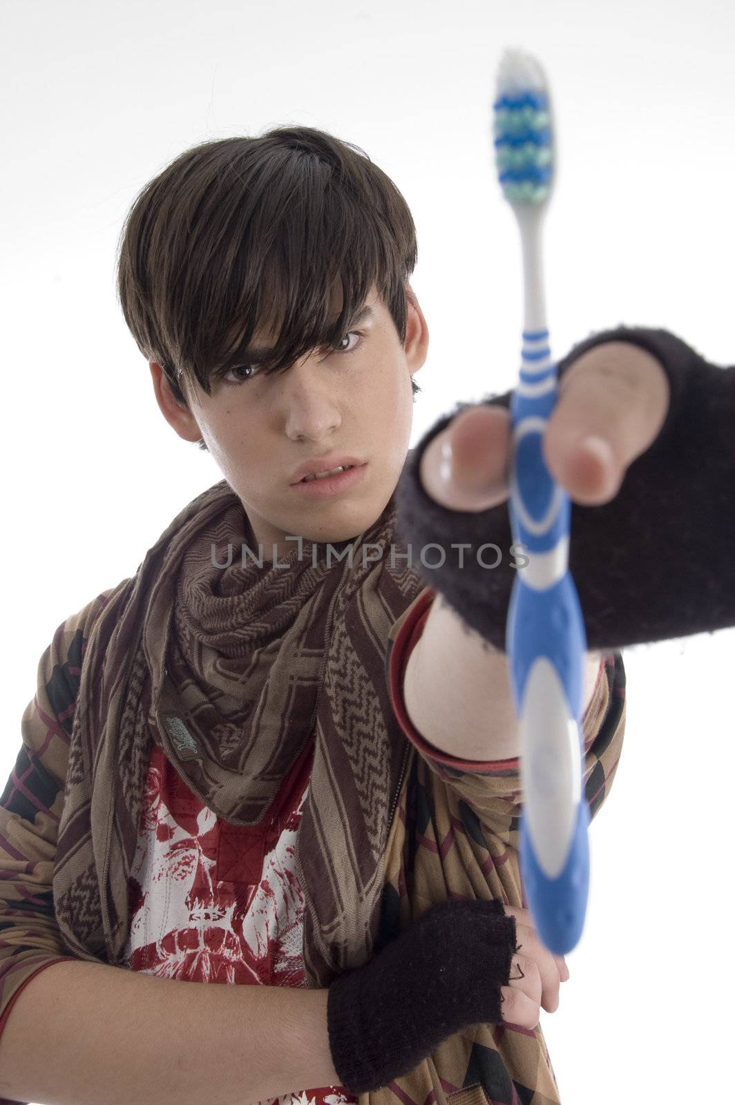 boy showing tooth brush on an isolated white background