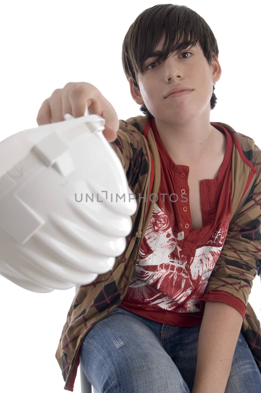 smiling young architect showing his helmet on an isolated background