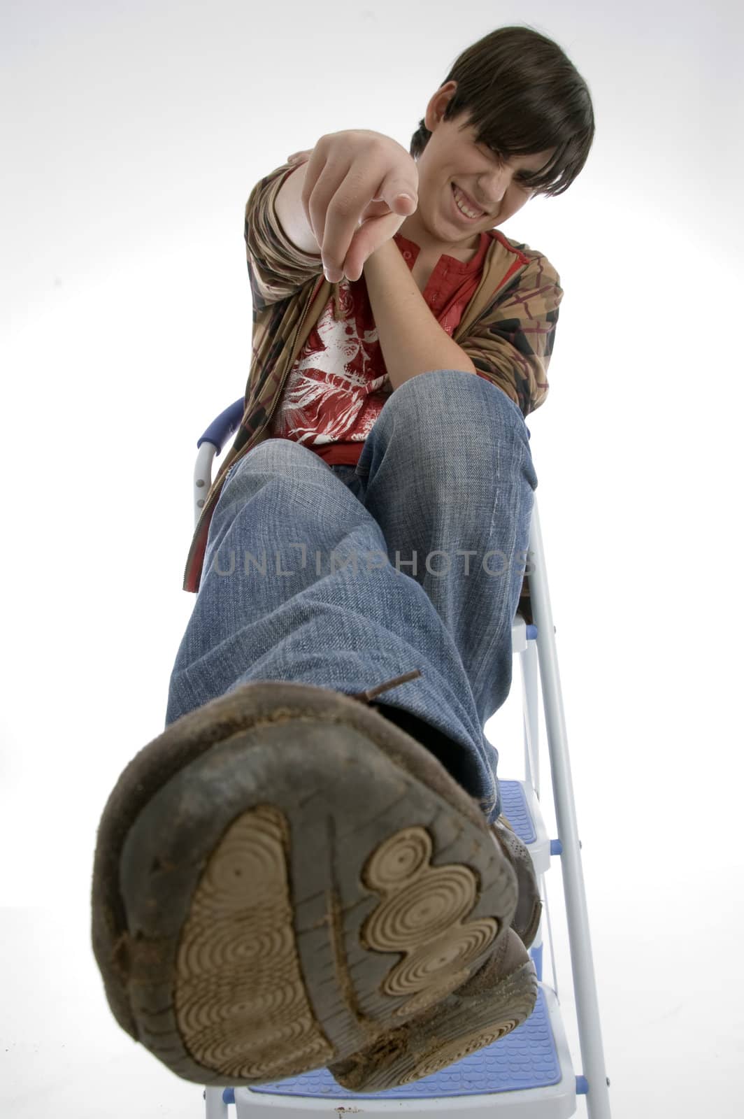 smiling boy pointing you with white background