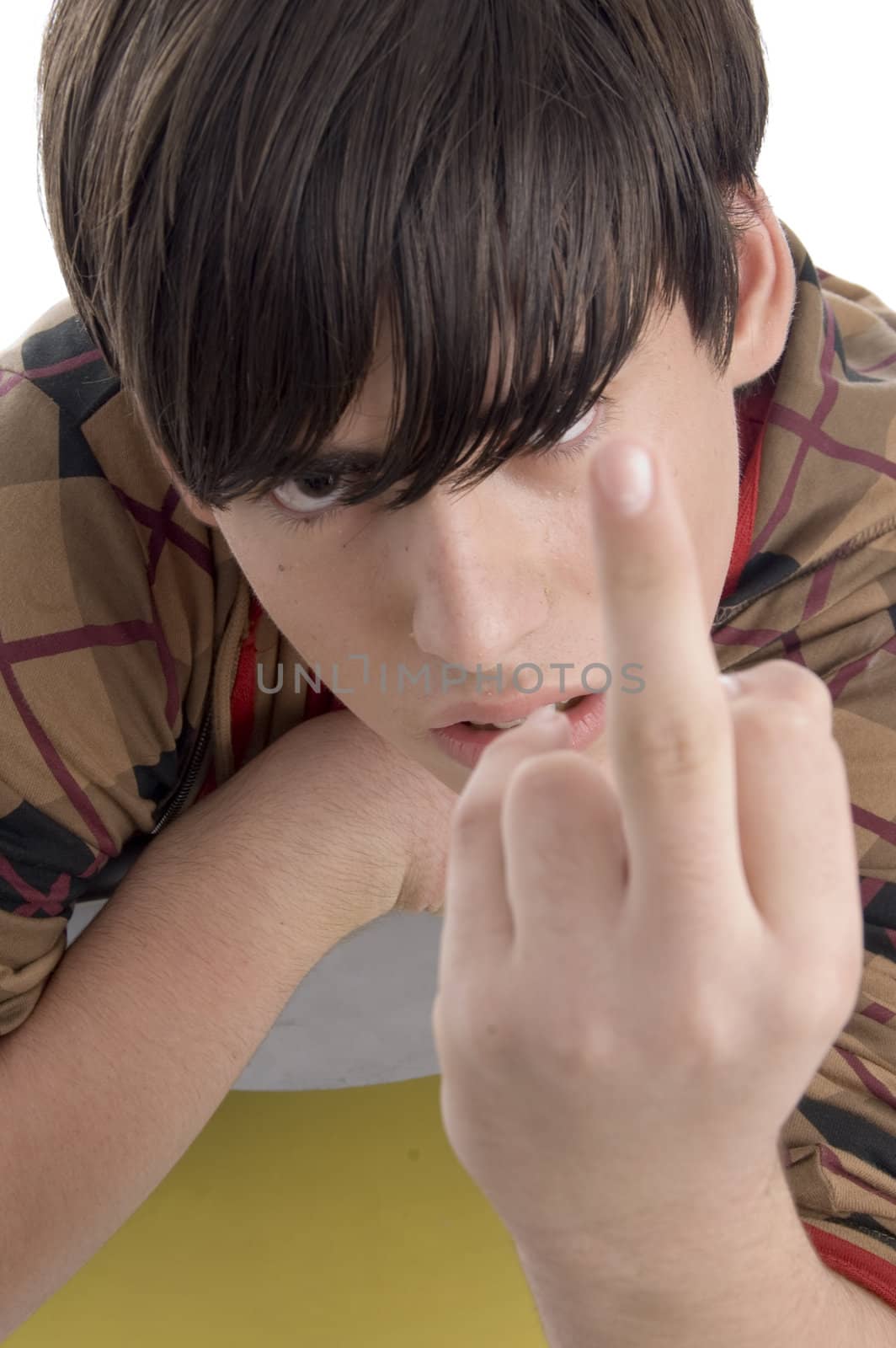 young boy showing you finger on an isolated white background