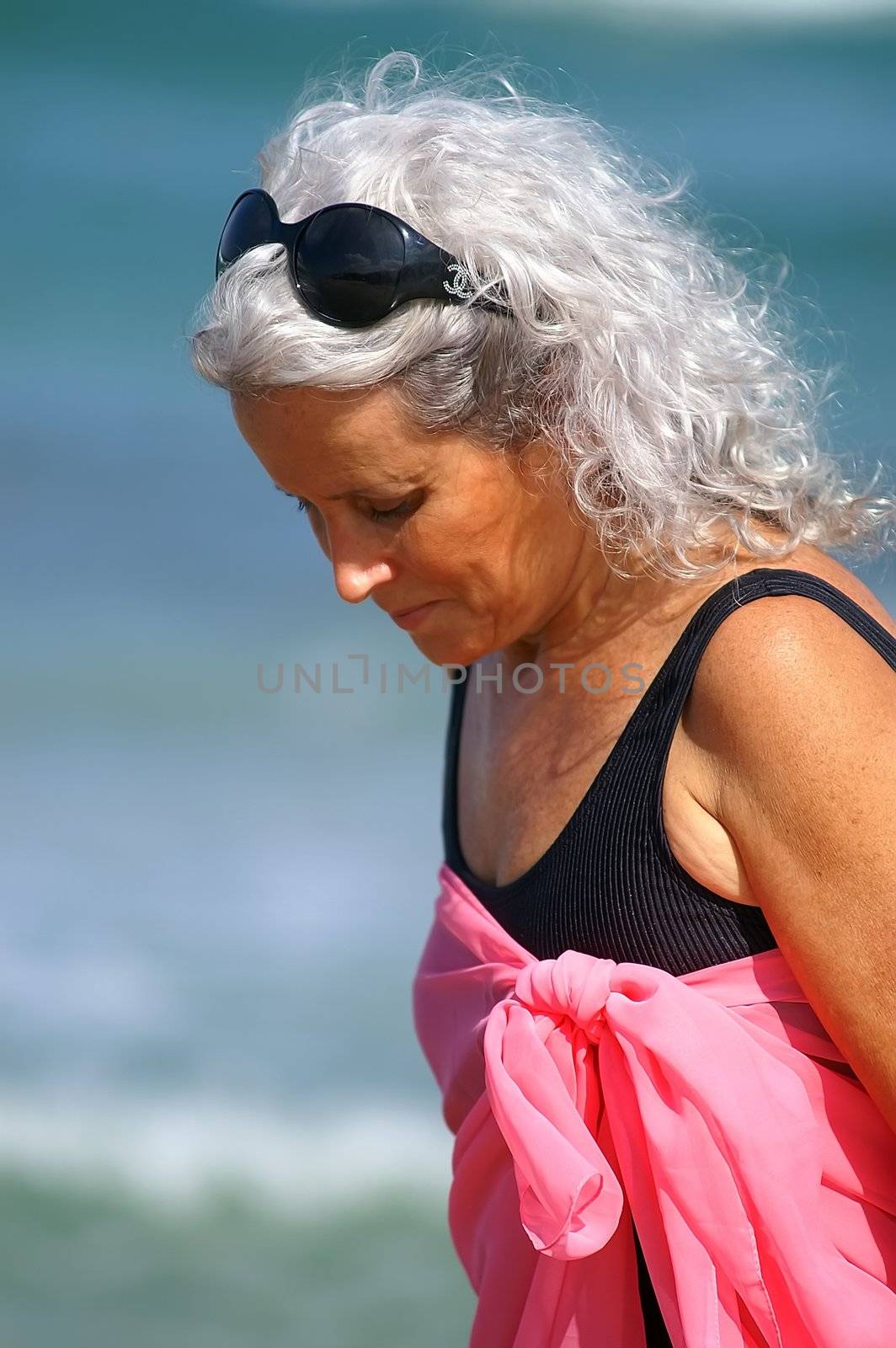 an elder woman at the beach