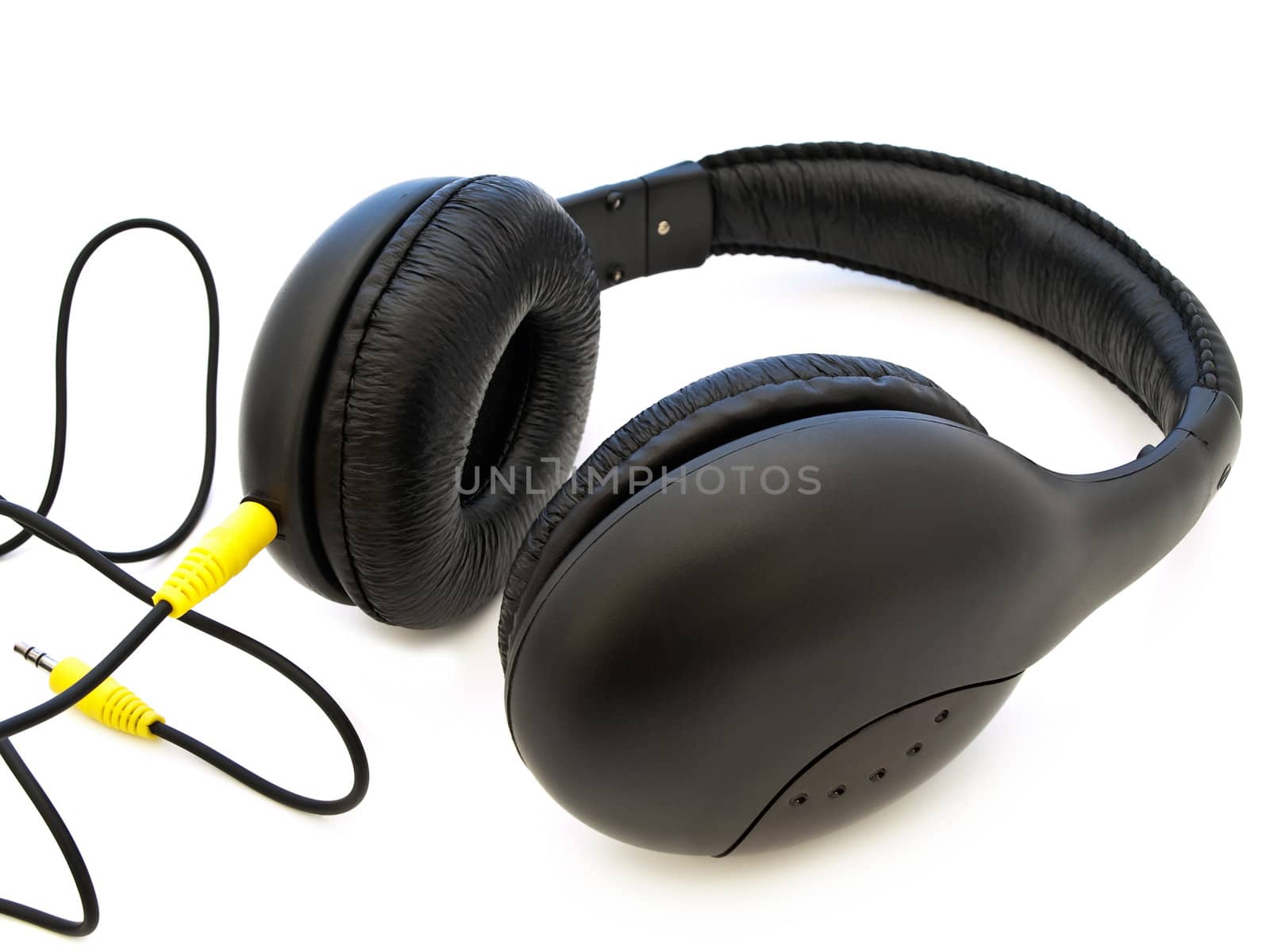Modern black headphones over white background