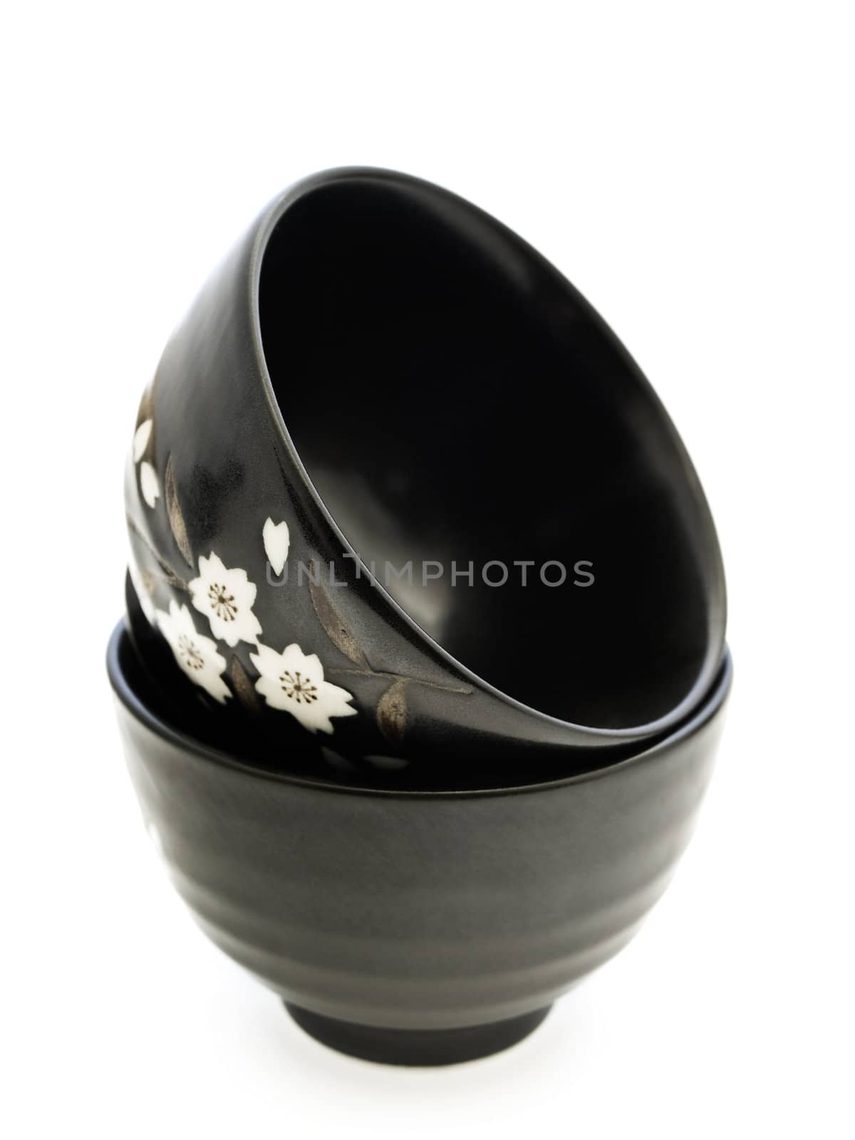 two black china bowls over white background