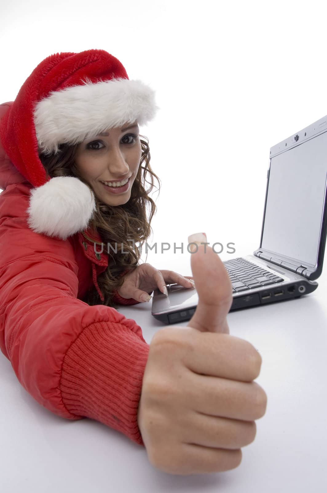 woman with laptop showing thumb gesture on an isolated background