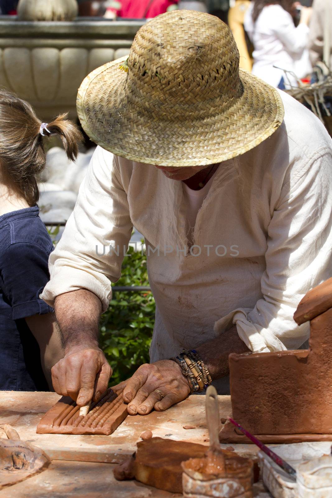 Men at work, clay craftsman by FernandoCortes