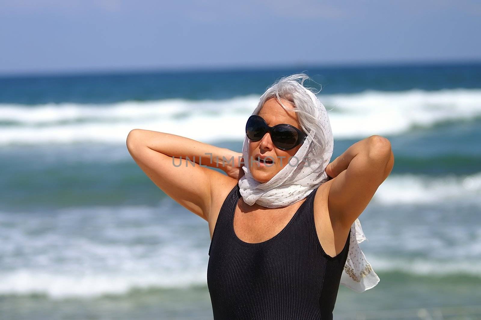 an elder woman at the beach