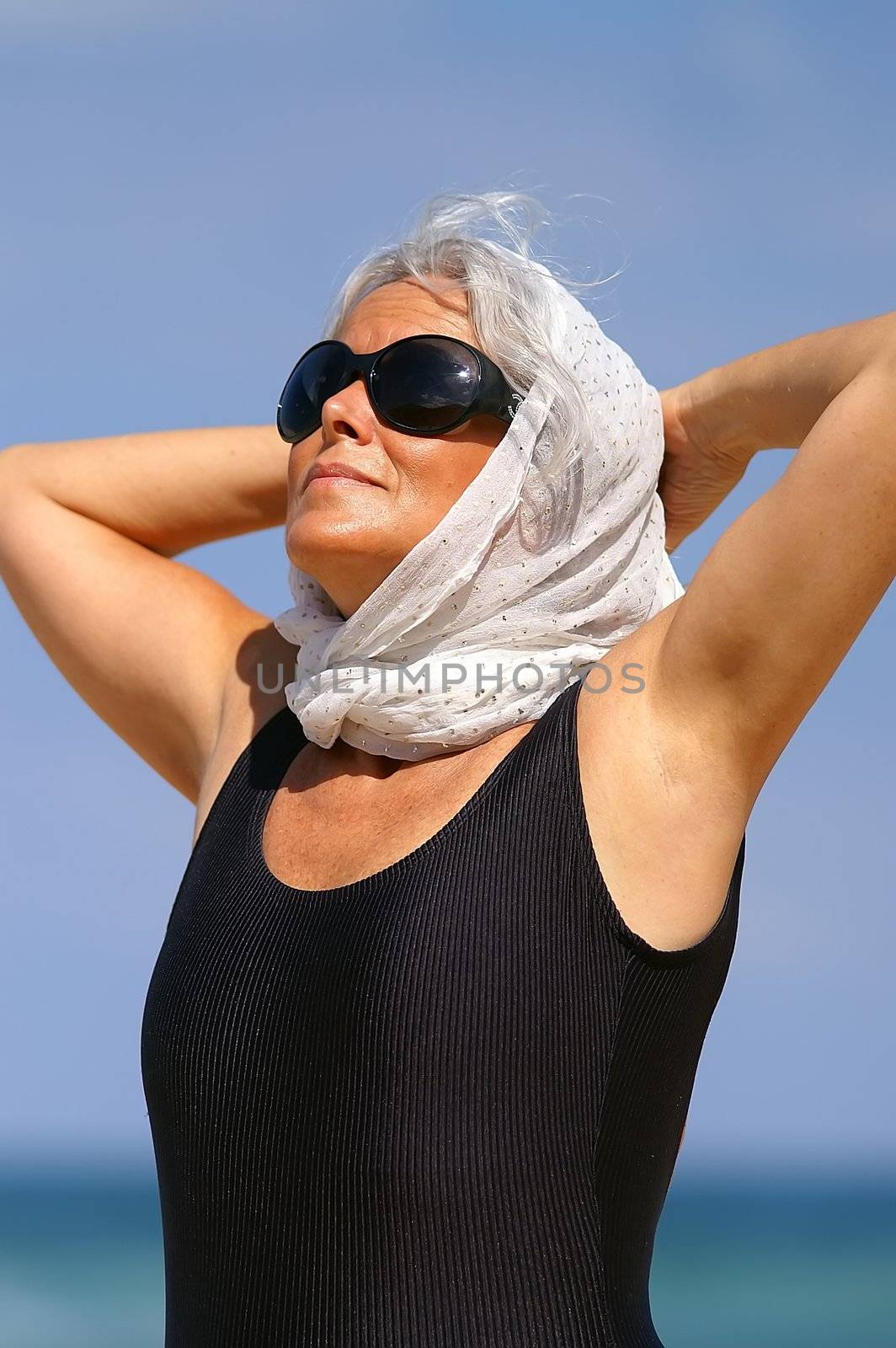 an elder female at the beach