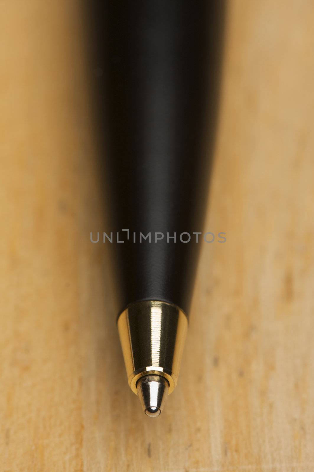 Ball Point Pen Macro on Wood Background with Narrow Depth of Field