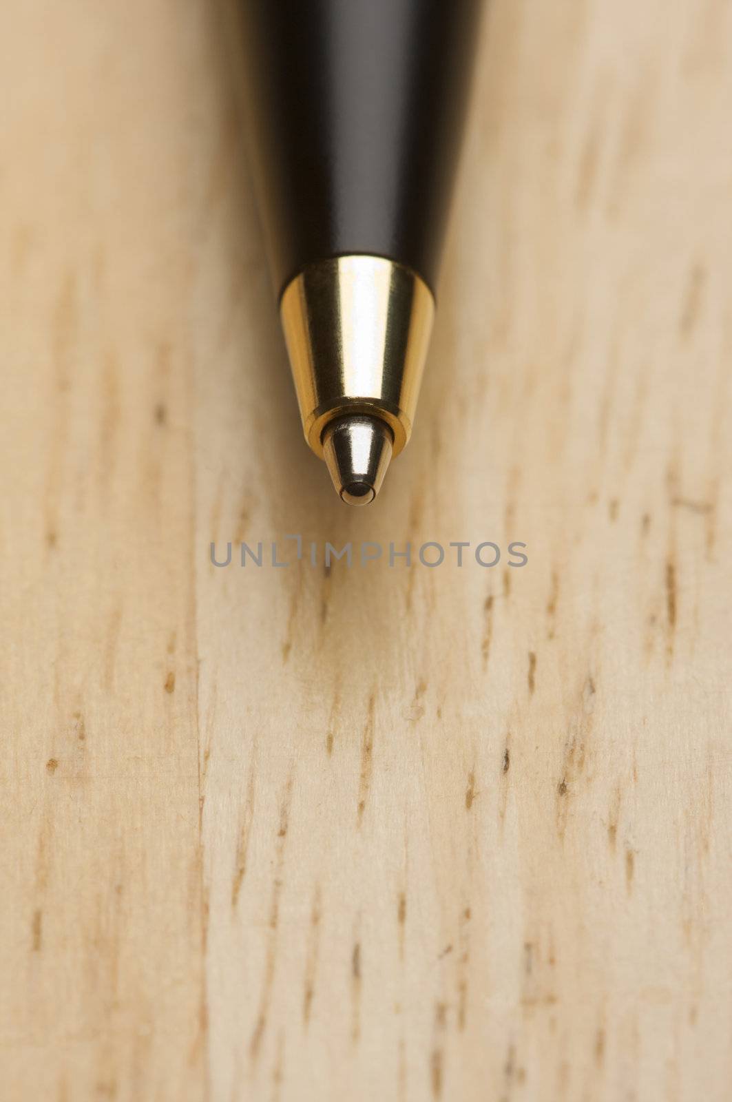 Ball Point Pen Macro on Wood Background with Narrow Depth of Field