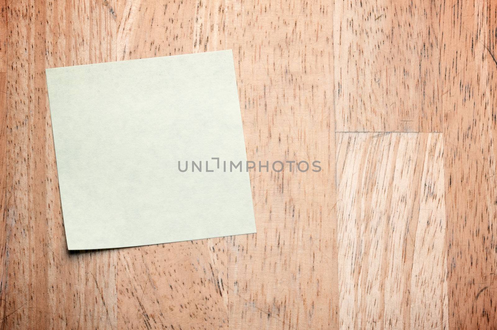 Post It Note on Wood Background