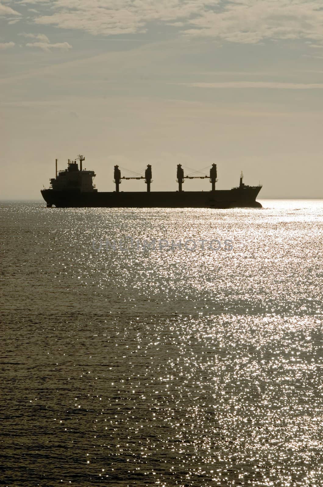 ship cruising on North Sea by sundown light