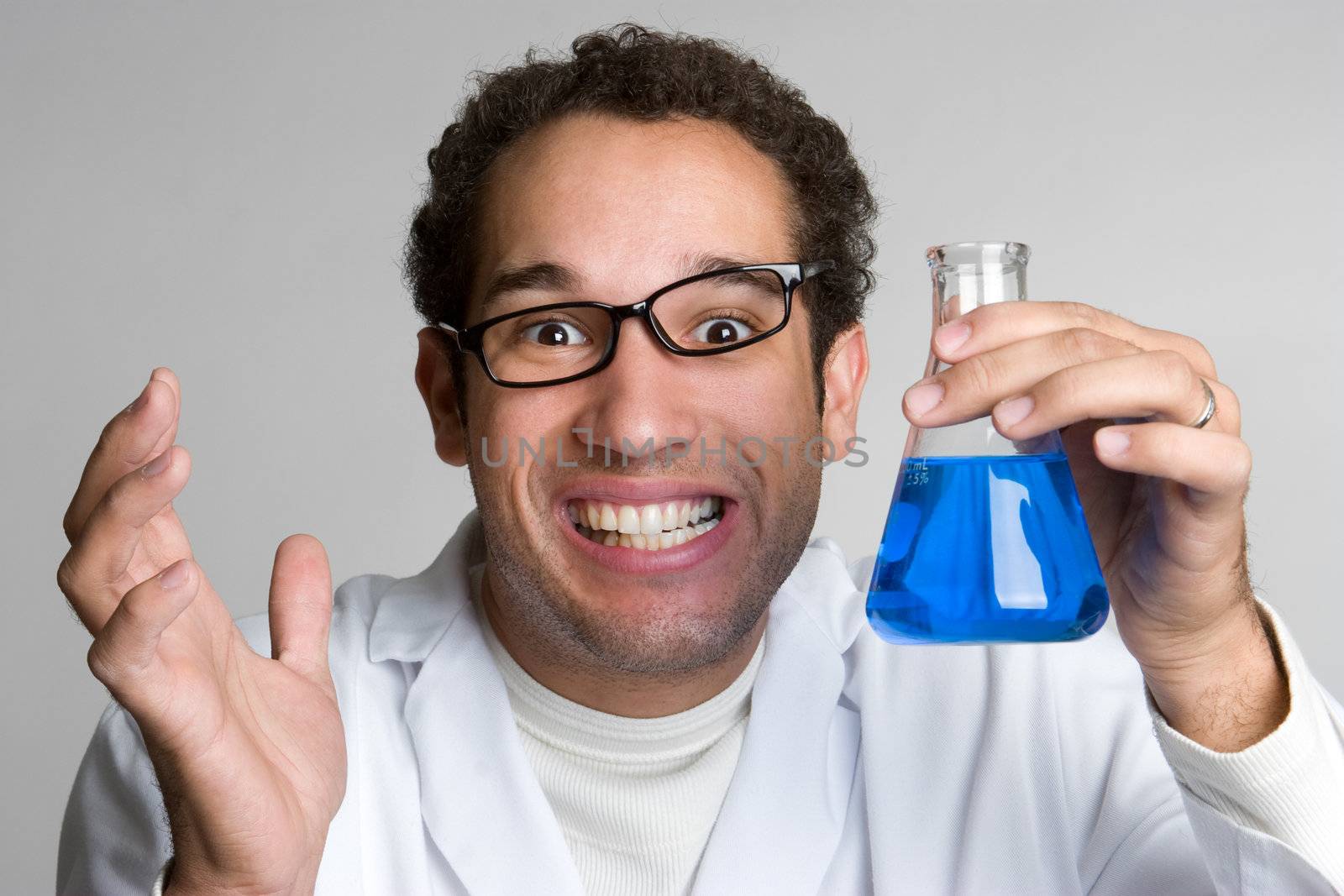 Mad scientist holding blue liquid vial